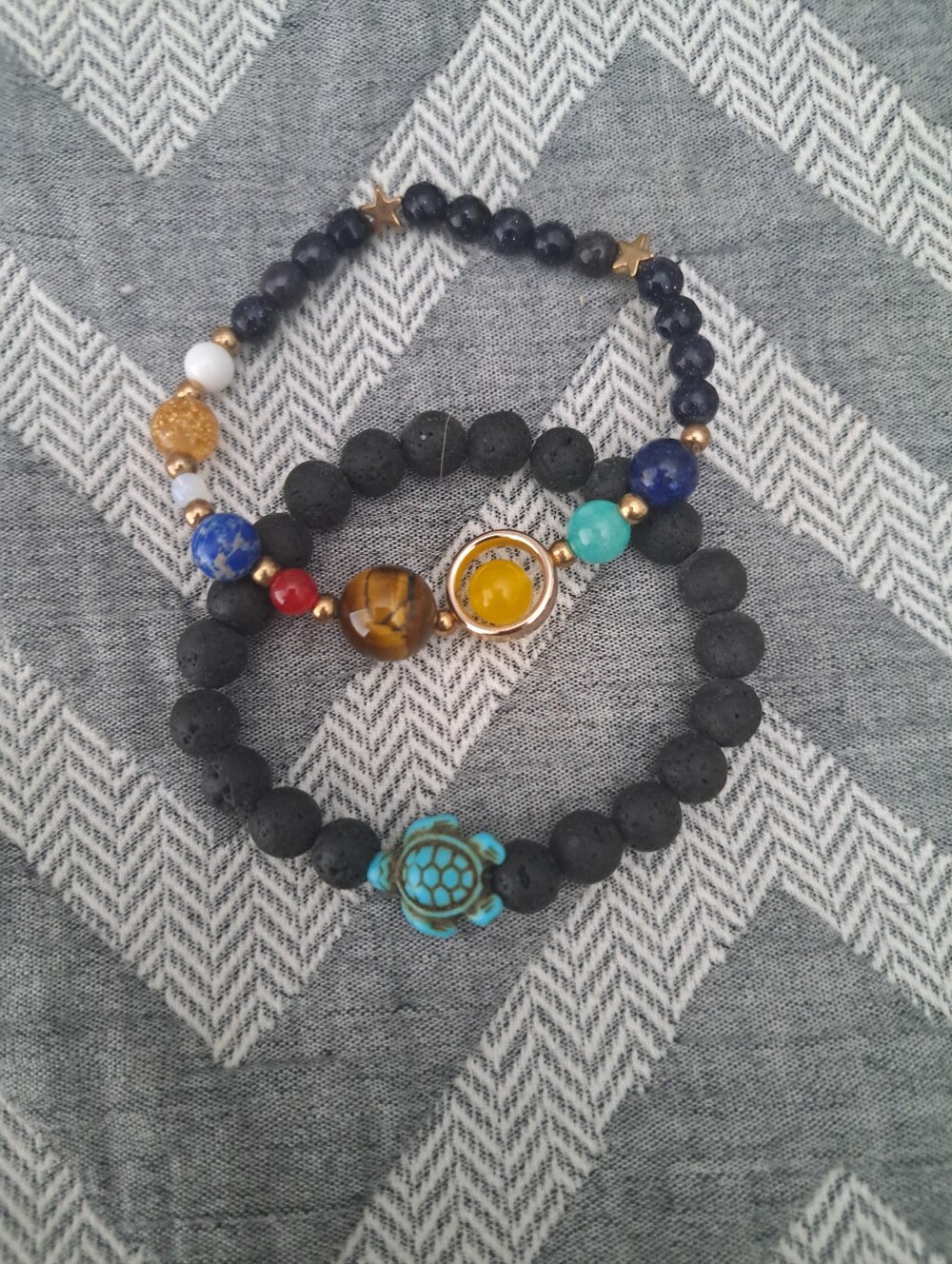 Turquoise Turtle with Lave Stones and Colorful Planets with Stars Bracelets.
